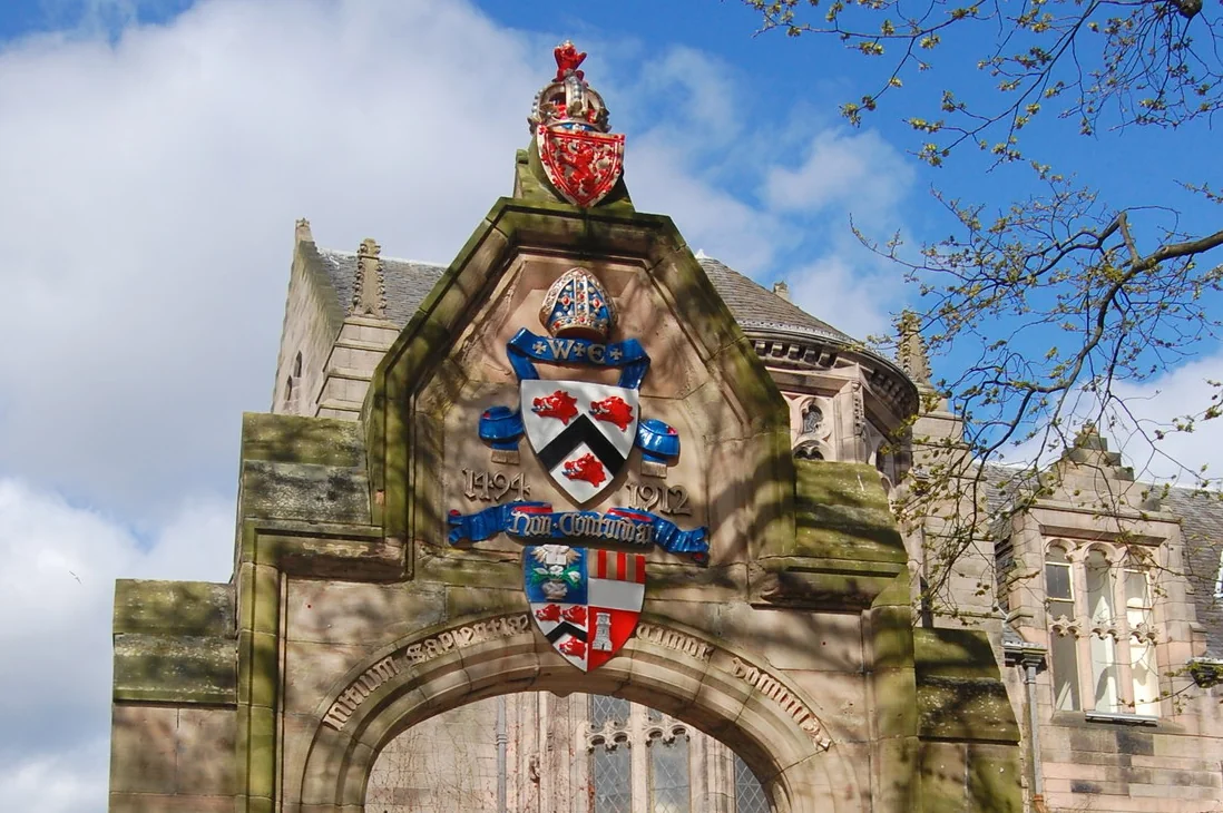 An ornate stone gateway at the University of Aberdeen, Scotland.
