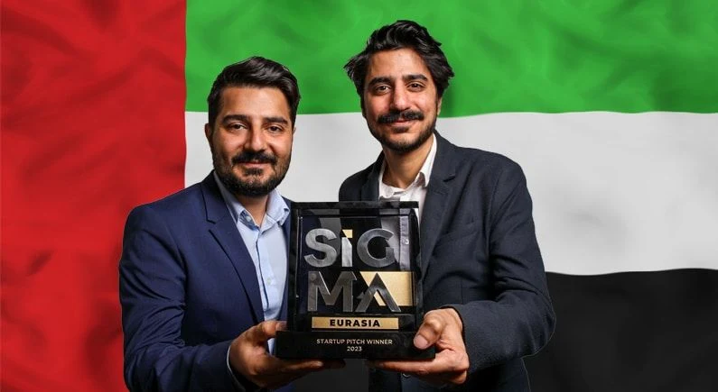 Monok’s founders holding the SiGMA Eurasia Startup Pitch Winner 2023 award.